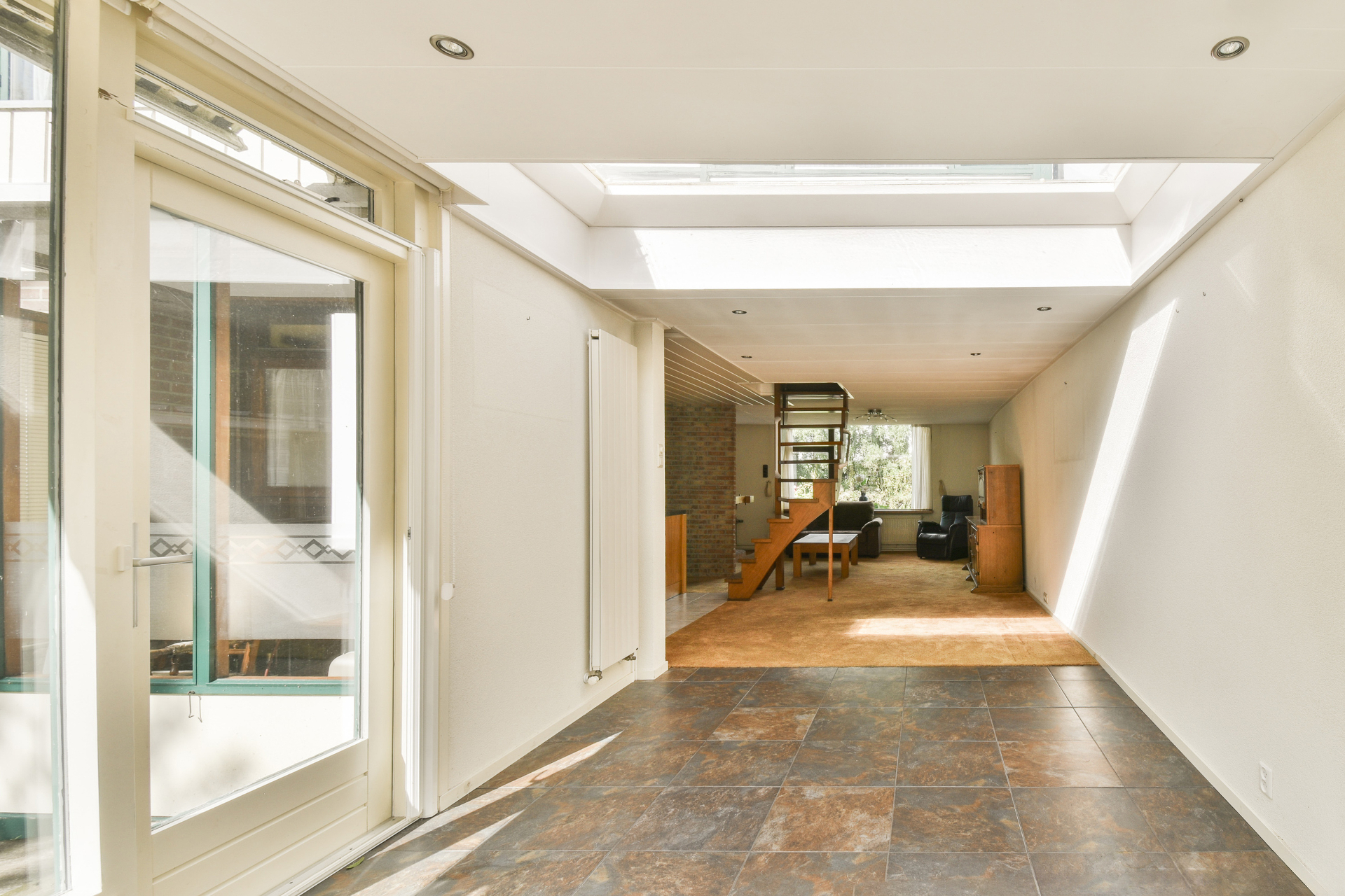 Spacious contemporary interior with floating stairs and open plan design