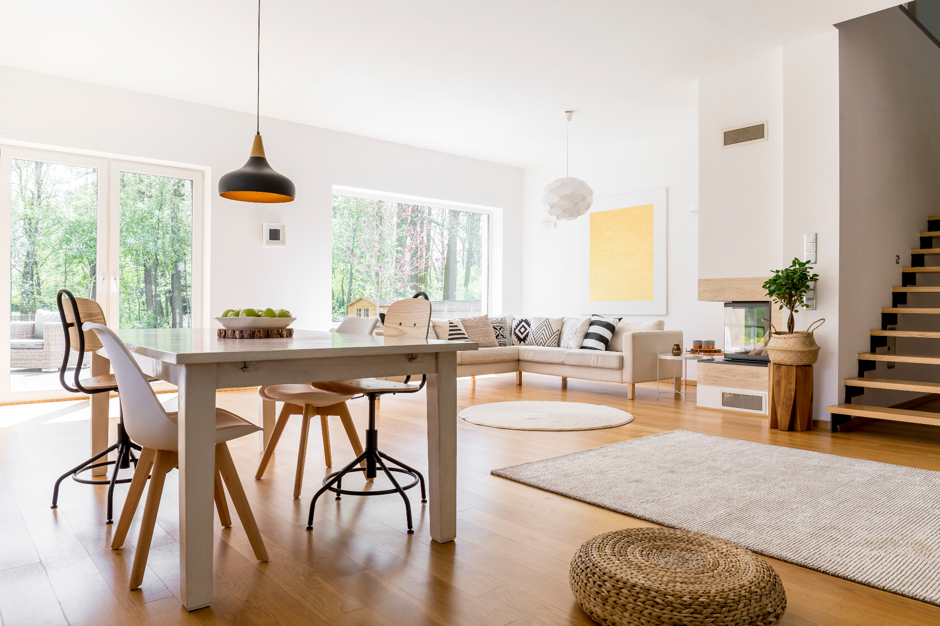Spacious open plan living area with dining table and comfortable seating arrangement