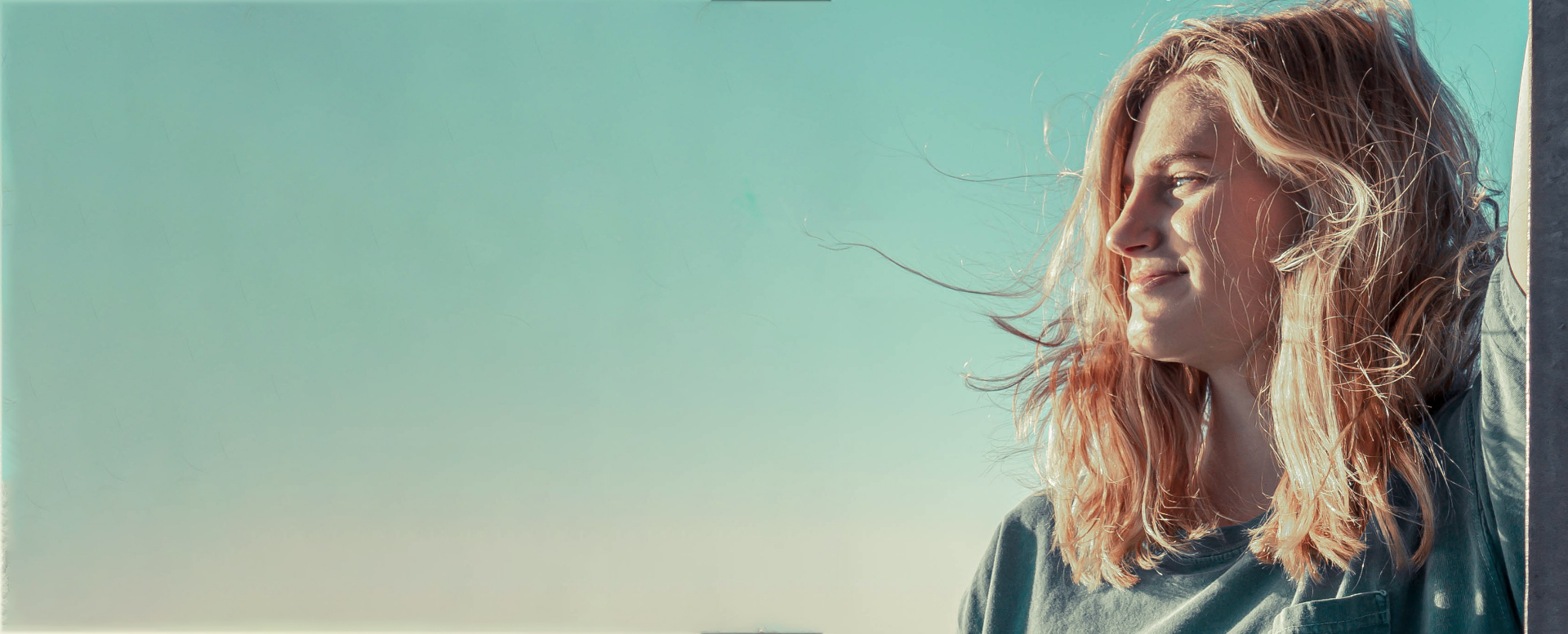 Beautiful natural portrait with flowing blonde hair in soft dreamy lighting